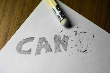 I can't, written in pencil with the t erasedの写真素材