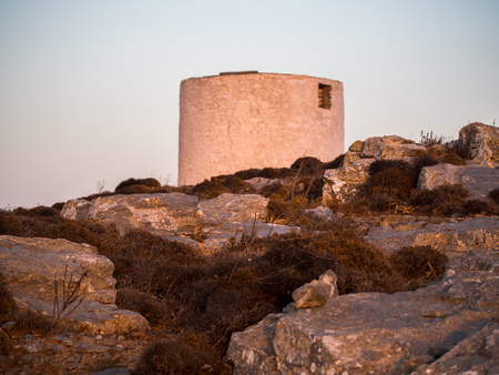 An abandoned windmill at the top of the Chora of Amorgosの写真素材