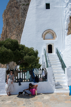 Amorgos,Greece.August 3,2017.At the entrance of the monastery of Panagia Hozoviotissa women must wear long skirts before enteringのeditorial素材