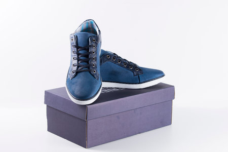 Male Blue Shoe on white background, isolated product, top view, studio.の写真素材