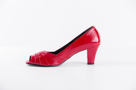 Beautiful elegance and luxury leather red shoes isolated on white backgroundの写真素材