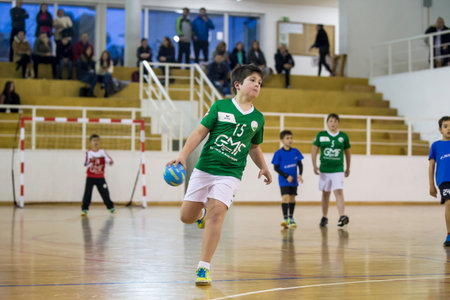 Afife, Viana do Castelo, Portugal - February 1, 2020: AD Afifense player in action against Becas B, game to count to the Minis Tournament organized by Afifense handball on February 1, 2020 in Afife.のeditorial素材