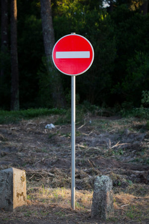 Traffic signal in a public garden. Prohibited sign.