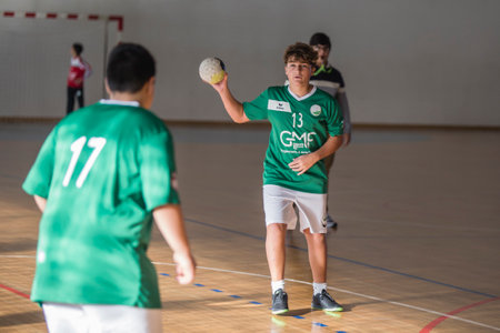 Afife, Viana do Castelo, Portugal - November 13, 2021: AD Afifense player in action against Vermoim, game counting for the Intantis Tournament organized by Afifense in handball on February 13, 2021のeditorial素材