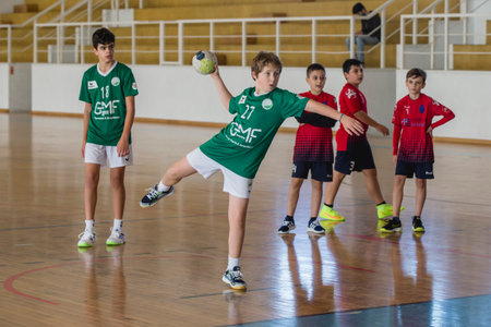 Afife, Viana do Castelo, Portugal - November 13, 2021: AD Afifense player in action against Vermoim, game counting for the Intantis Tournament organized by Afifense in handball on February 13, 2021のeditorial素材