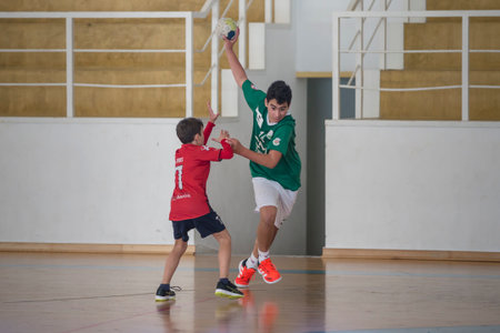 Afife, Viana do Castelo, Portugal - November 13, 2021: AD Afifense player in action against Vermoim, game counting for the Intantis Tournament organized by Afifense in handball on February 13, 2021のeditorial素材