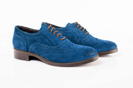 Male blue leather shoes on white background, isolated product. Differentiated footwear and exclusive design.の写真素材