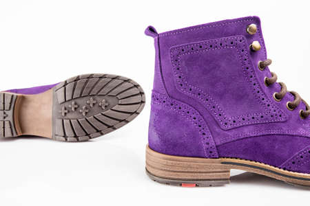 Male purple leather boot on white background, isolated product. Differentiated footwear and exclusive design.の写真素材