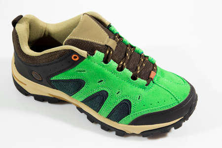 Male green leather sneaker on white background, isolated product.の写真素材