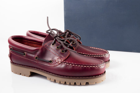 Male red leather shoes pairs on white background, isolated product.の写真素材