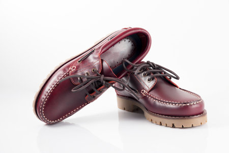 Male red leather shoes pairs on white background, isolated product.の写真素材