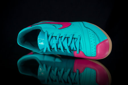 Portugal, September 28, 2022:Nike Sneaker soccer. Nike, Multinational company. Isolated on black. Product shots.のeditorial素材