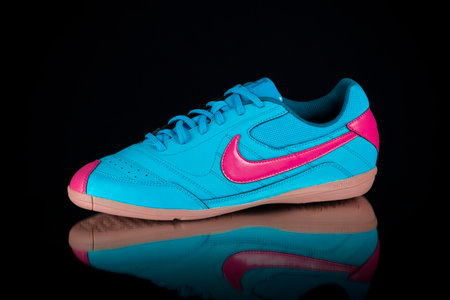 Portugal, September 28, 2022:Nike Sneaker soccer. Nike, Multinational company. Isolated on black. Product shots.のeditorial素材