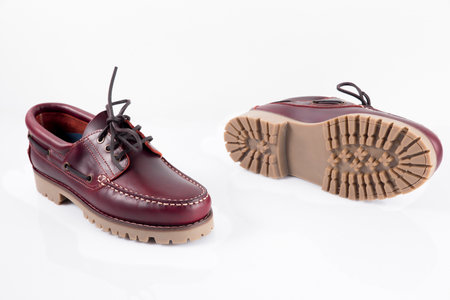 Male red leather shoes pairs on white background, isolated product.の写真素材