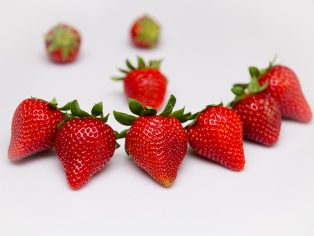 Detail of ripe organically grown strawberries looking great isolated.の写真素材