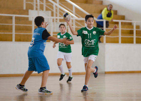 Viana do Castelo, Portugal - February 15, 2020: AD Afifense player in action against Becas B, game to count for the Minis Tournament organized by Afifense handball.のeditorial素材