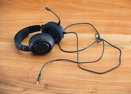 Headphones on a wooden table. Headphones on a wooden background.の写真素材