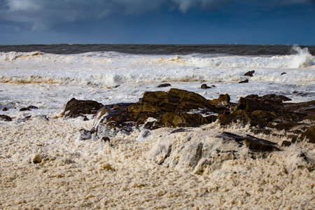 Stormy Baltic sea with big waves and rocks, Liepaja, Latviaの写真素材