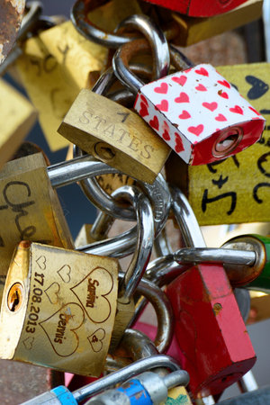 Colorful love padlocks on a fence