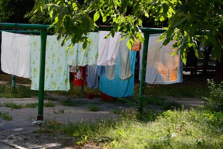 Clothes drying outside on a line in the cityの写真素材