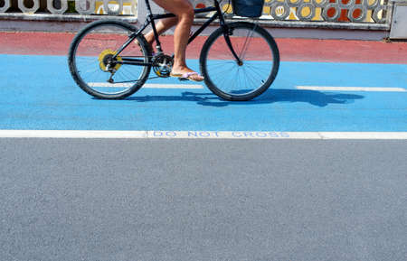 woman cycling on the bike pathの写真素材