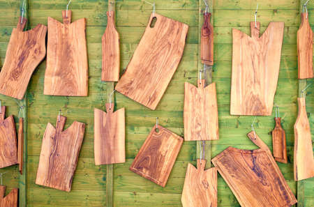 wooden cutting boards on green backgroundの写真素材