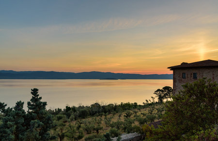 Sunrise at Lake Trasimeno from Castiglione del Lago, umbria, italyの写真素材