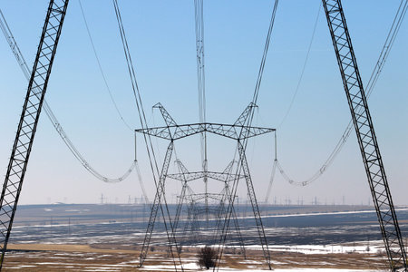 High voltage towers with sky background