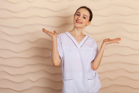 Portrait of a smiling young woman. Professional and experienced masseuse.の写真素材