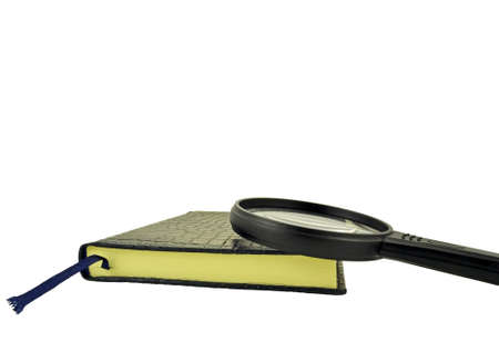 Isolation closed book and magnifying glassの写真素材