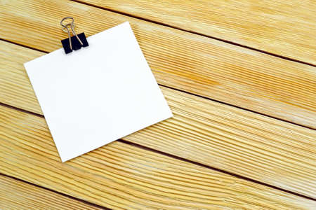 Image blank paper notes on a background of wooden boardsの写真素材