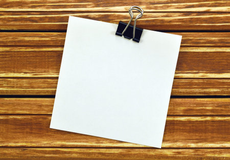 Image blank sheet of paper notes on a background of wooden boardsの写真素材