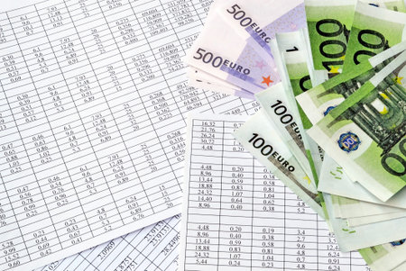 Euro money on a background of financial numbers and documents