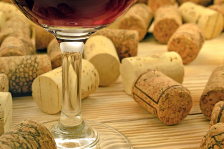Image of glasses of red wine on the background of corksの写真素材
