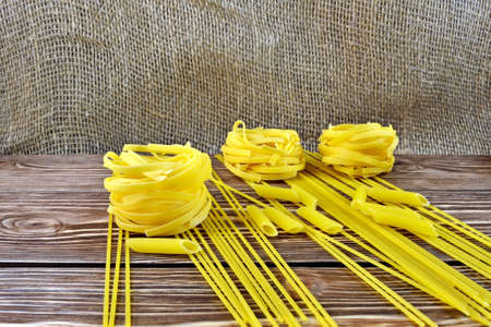 Macaroni and spaghetti on the tableの写真素材
