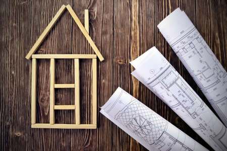 House made of wooden sticks and project drawingsの写真素材