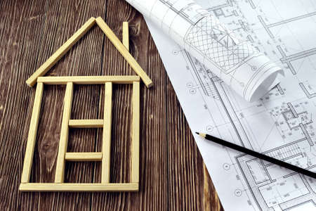 House made of wooden sticks and project drawingsの写真素材