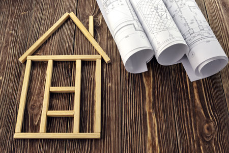 House made of wooden sticks and project drawings
