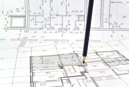 Plan and planning designed building with a pencil on the drawingの写真素材