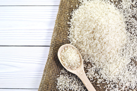 Photo spoon with rice on sackingの写真素材