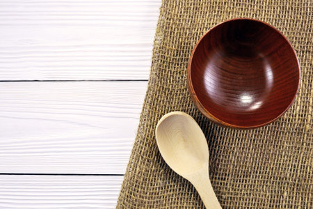 Photos wooden spoons and bowls on the tableの写真素材