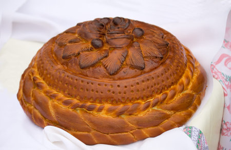 On a white towel is a beautifully decorated cake.
