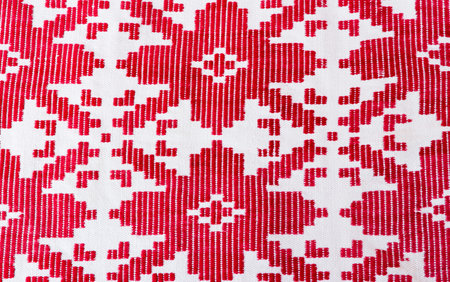 Ancient homespun towel from flax (fragment) with a beautiful red pattern.