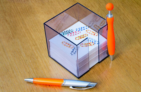 Two handles of bright orange color for the letter and scratch paper in the container. Are located...