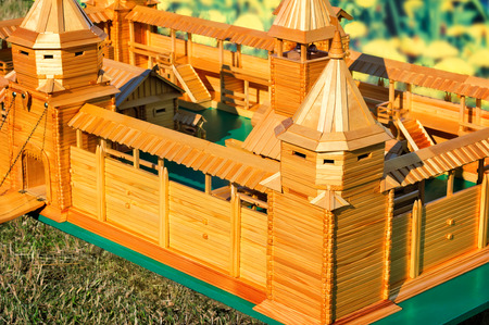 Depicted artful is made of natural wood the layout of an ancient fortress with ramparts, towers, gates, stairs, outbuildings.の写真素材