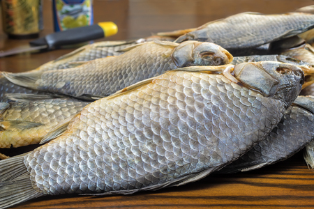 On the surface of the table is the salted and dried large fish.の写真素材