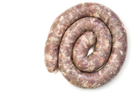 Rolled in the ring of raw sausage from pork. Presented on a white background.の写真素材