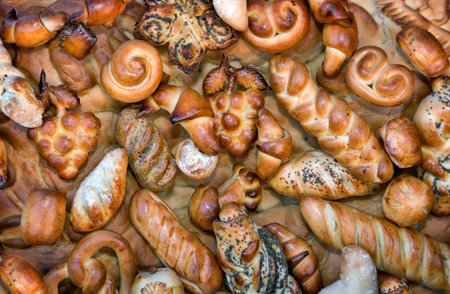 Various shapes buns and delicious white bread. Presents closeup.