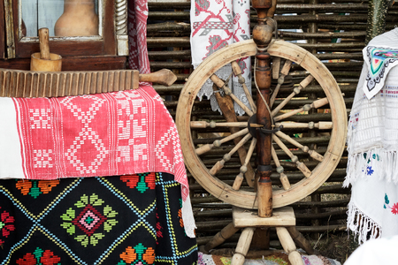 Vintage wooden spinning wheels , interior items and handmade household items.の写真素材