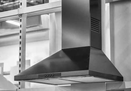 Convenient operation kitchen hood with toggle modes. Presented in the storefront. Black-and-white image.の写真素材